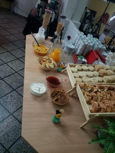 a table with cookies and other food on it at Hotel Garden in San Miguel de Tucumán