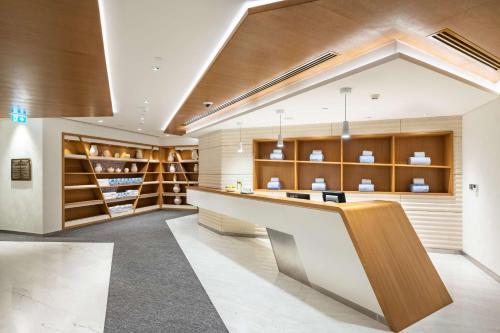 a wine tasting room with a counter and shelves at Radisson Blu Hotel & Residence, Riyadh Diplomatic Quarter in Riyadh