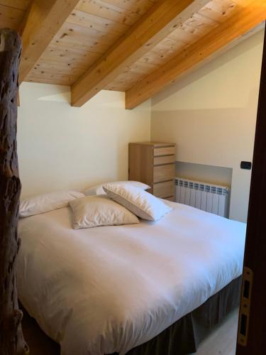 Postel nebo postele na pokoji v ubytování Chalet Nocciolini