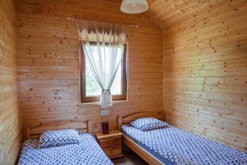Postel nebo postele na pokoji v ubytování Nadmorski Zakątek