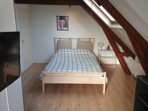 a bedroom with a bed in a attic at Miriam's Suite Amsterdam in Amsterdam