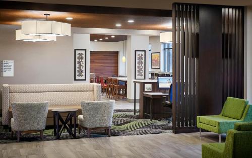a lobby with a waiting area with chairs and a table at Holiday Inn Express Niagara-On-The-Lake by IHG in Niagara-on-the-Lake
