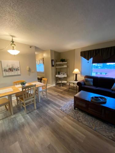 a living room with a couch and a table at River Place Condos #401 2BD in Pigeon Forge