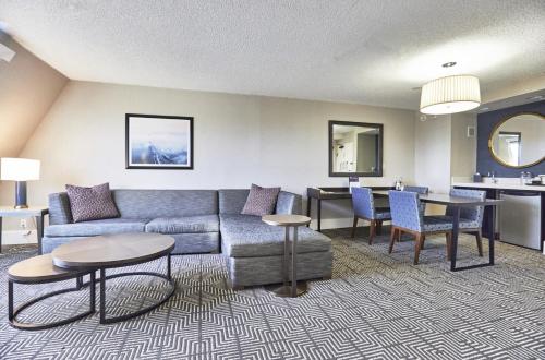 a living room with a couch and a table at Riu Plaza Fisherman's Wharf in San Francisco