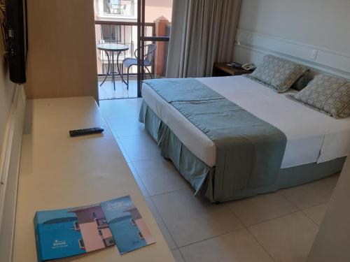 Postel nebo postele na pokoji v ubytování Jurerê Beach Village - Studio Lateral Luxo