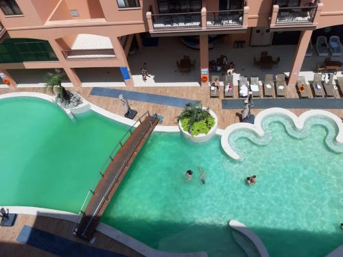 Bazén v ubytování Jurerê Beach Village - Studio Lateral Luxo nebo v jeho okolí