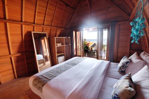 Postel nebo postele na pokoji v ubytování Adara Beach Huts
