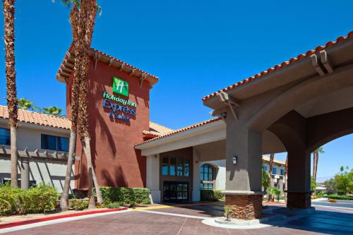a hotel with a sign on the side of a building at Holiday Inn Express & Suites Rancho Mirage - Palm Spgs Area by IHG in Rancho Mirage