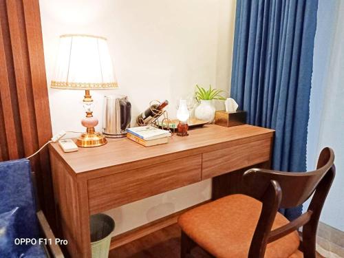 a desk with a lamp and other items on it at Sapa Eco Villas & Spa in Sa Pa