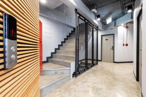 a stairwell in a building with a stair case at Rest24 Residence in Bangkok