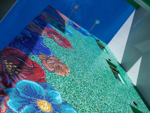 a view of the top of a building with a painting at The Moana by DSH Resorts in Chatan