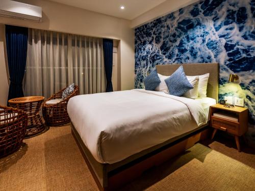 Postelja oz. postelje v sobi nastanitve The Moana by DSH Resorts