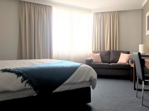 Brisbane City Apartments (Albert St CBD) tesisinde bir odada yatak veya yataklar