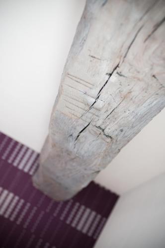a piece of wood sitting on top of a table at Apartment De Maasnacht in Maaseik