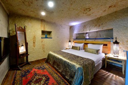 Ένα ή περισσότερα κρεβάτια σε δωμάτιο στο Cappadocia Estates Hotel
