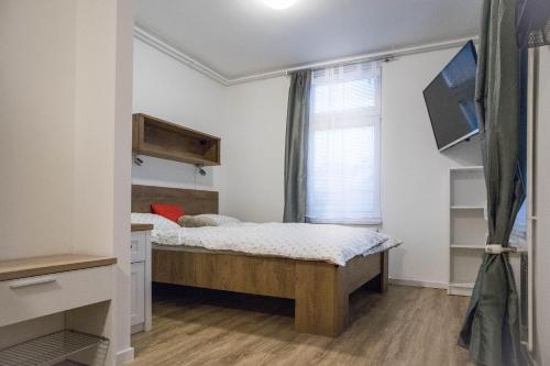 Postel nebo postele na pokoji v ubytování Jantar Apartmaji