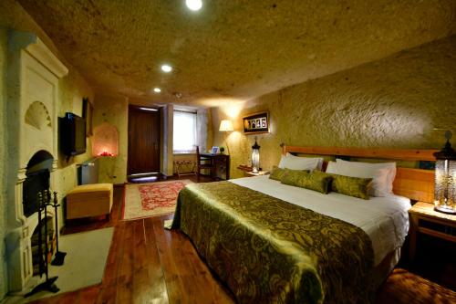 Ένα ή περισσότερα κρεβάτια σε δωμάτιο στο Cappadocia Estates Hotel