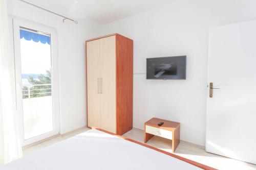 TV a/nebo společenská místnost v ubytování APARTMENT ARIA