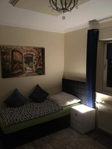 a small bedroom with a bed and a window at Hotel Restaurant Hesch in Gabersdorf