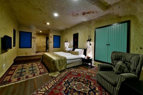Ένα ή περισσότερα κρεβάτια σε δωμάτιο στο Cappadocia Estates Hotel
