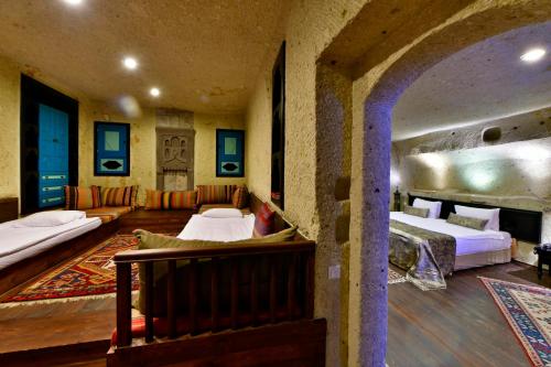 Ένα ή περισσότερα κρεβάτια σε δωμάτιο στο Cappadocia Estates Hotel