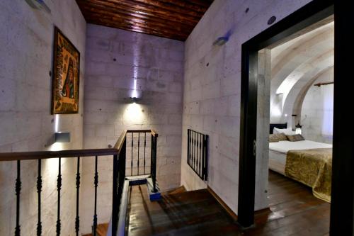 Ένα ή περισσότερα κρεβάτια σε δωμάτιο στο Cappadocia Estates Hotel