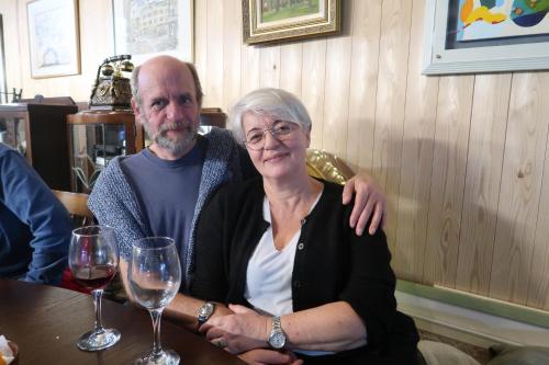a man and a woman sitting at a table with wine glasses at B&B MIKAWA 2 - Kanazawa Fish Harbour in Kanazawa