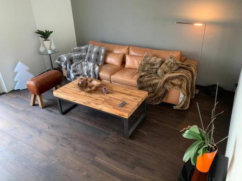 a living room with a couch and a coffee table at Central & Elegant Room in Biel in Biel