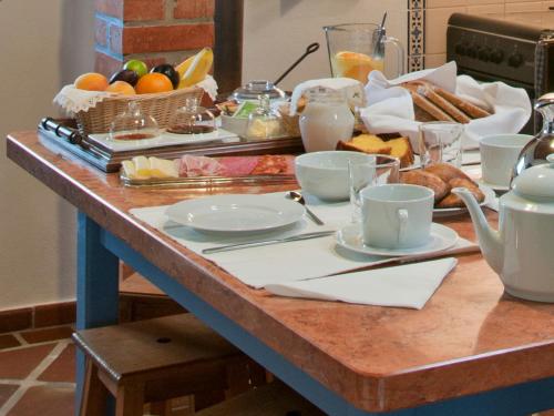 a breakfast table with a buffet of breakfast foods at Casas Dos Infantes - Turismo Rural in Caldas da Rainha