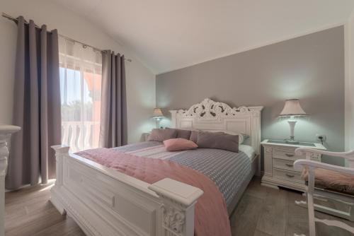Postel nebo postele na pokoji v ubytování Nena apartmani