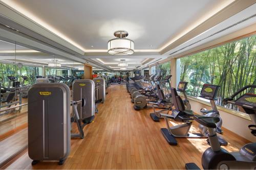 a gym with rows of treadmills and elliptical machines at Mandarin Oriental Bangkok - SHA Extra Plus in Bangkok
