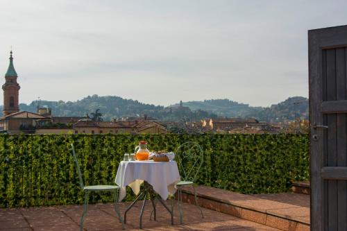 a table with a bottle of orange juice on it at Hotel Pedrini in Bologna