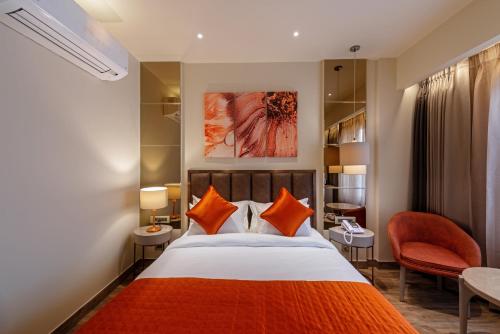 Postel nebo postele na pokoji v ubytování Hotel Saket 27