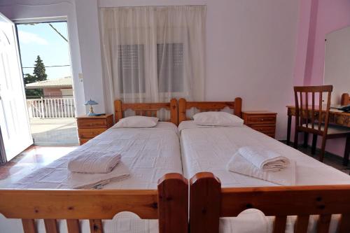 Ένα ή περισσότερα κρεβάτια σε δωμάτιο στο Maria Apartments
