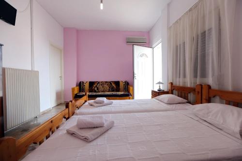 Postel nebo postele na pokoji v ubytování Maria Apartments