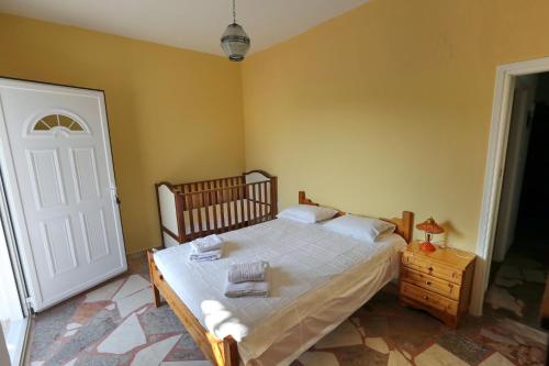 Ένα ή περισσότερα κρεβάτια σε δωμάτιο στο Maria Apartments