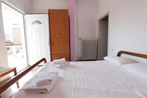 Ένα ή περισσότερα κρεβάτια σε δωμάτιο στο Maria Apartments