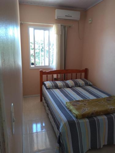 Postel nebo postele na pokoji v ubytování Excelente apartamento por temporada na praia da barrinha