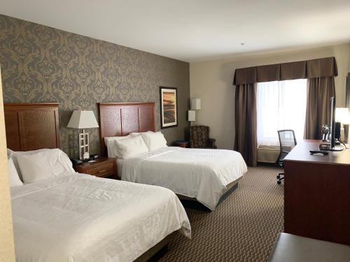 Ένα ή περισσότερα κρεβάτια σε δωμάτιο στο Holiday Inn Express Holland, an IHG Hotel
