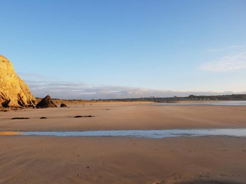 a view of a beach with the ocean at LE PETIT NID DANS LA ROULOTTE in Roscanvel