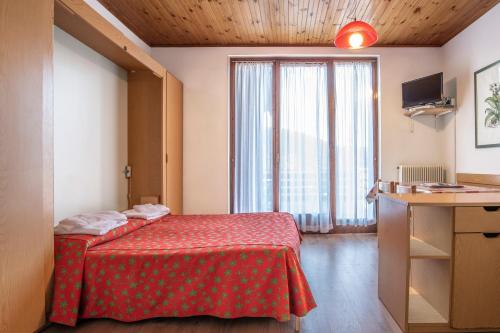Letto o letti in una camera di Alaska Clubresidence