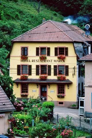 a building with a hotel restaurant maker written on it at L'AO Hôtel & Restaurant L'Aigle d'Or in Rimbach-près-Guebwiller