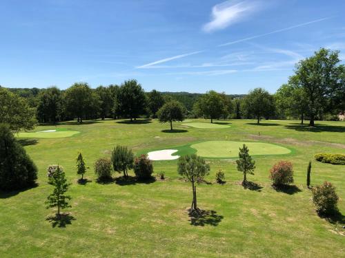 an overhead view of a golf course at Hôtel Domaine de l'Orangerie in Bonnat