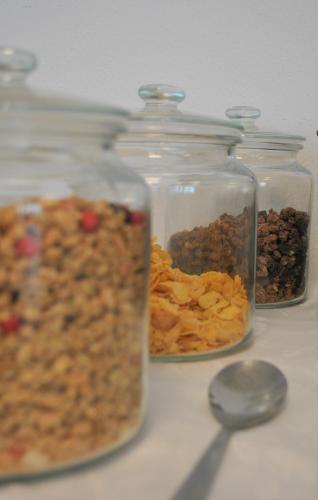 four glass jars filled with different types of food at Hotel Mauernböck in Rottenbach