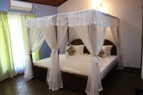 מיטה או מיטות בחדר ב-Xotic Resort