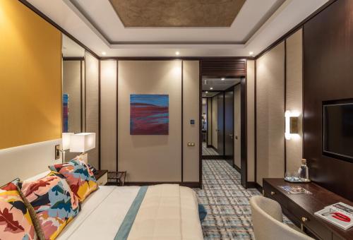 a hotel room with a bed and a desk at SOHO boutique hotel in Dnipro
