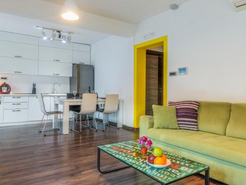 a living room with a couch and a table at Apartments Windrose in Kotor