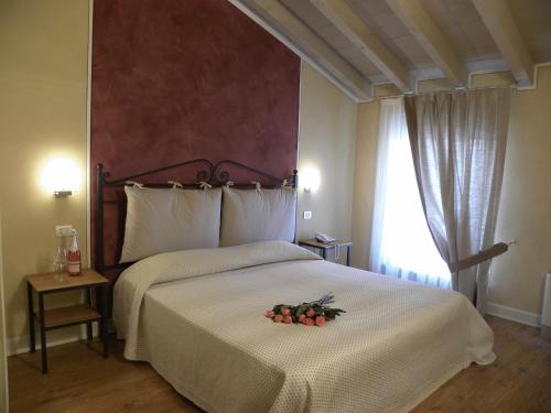 Postel nebo postele na pokoji v ubytování Agriturismo Feliciana