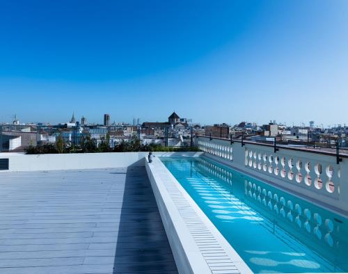 a swimming pool on the roof of a building at Hotel Raval House in Barcelona