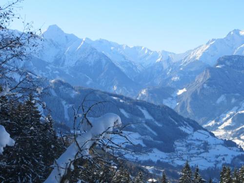 a snowy mountain range with snow covered mountains at Gästehaus Pfister Maria in Hippach